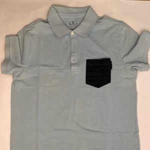 Medium polo shirt, light blue with textured navy pocket on the side